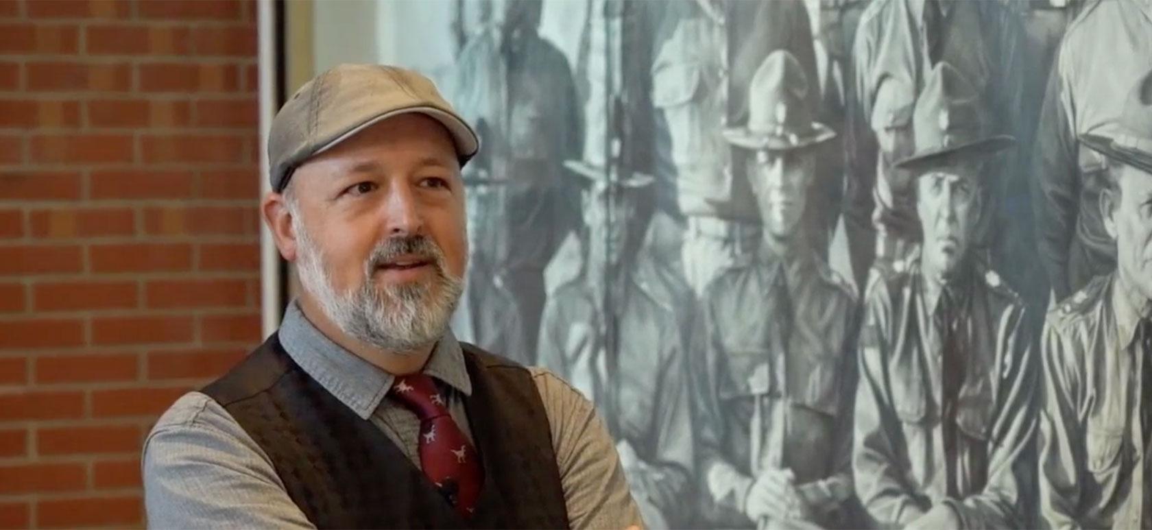 Chris LaPorte in front of his large drawing